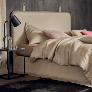 Leitner Isabella tailored bedskirt panels in champagne jacquard on styled bed.