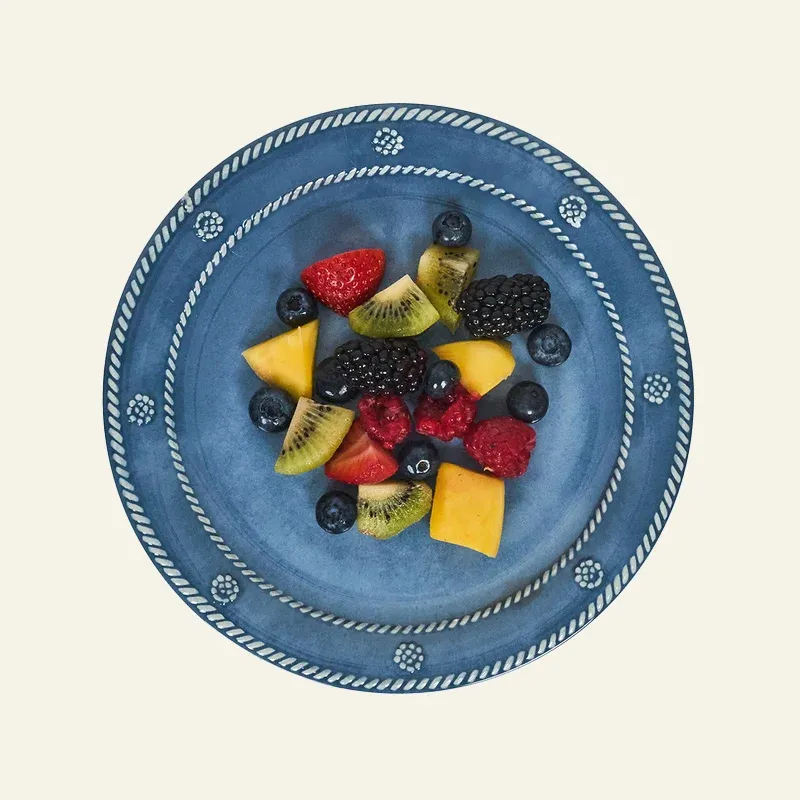 Juliska Berry & Thread melamine salad plate in blue with rope border, styled with fresh fruit.