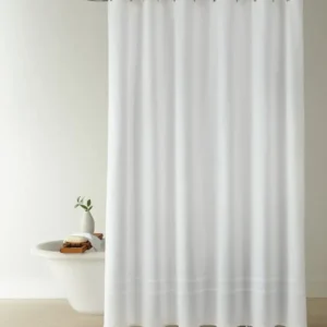 Peacock Alley Montauk Matelassé shower curtain in white with border detail.