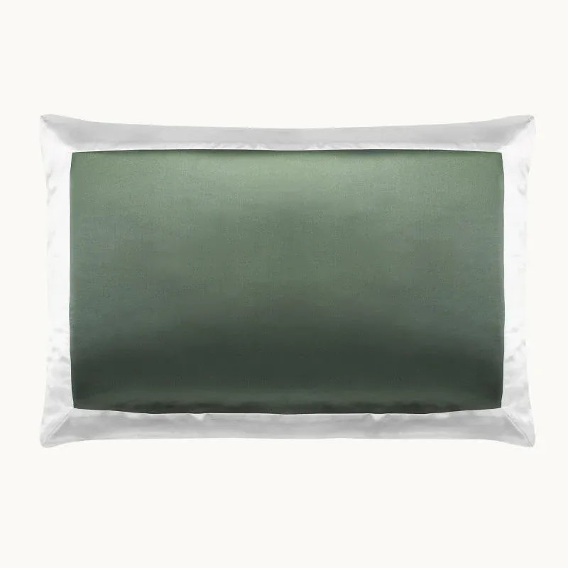 Gingerlily London Ashdown sage green silk pillowcase with white border, flat lay.