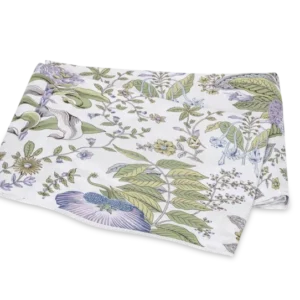 Matouk Pomegranate Schumacher flat sheet, white with green and blue botanical print.