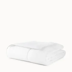 Peacock Alley down alternative duvet folded in white, smooth cotton shell.