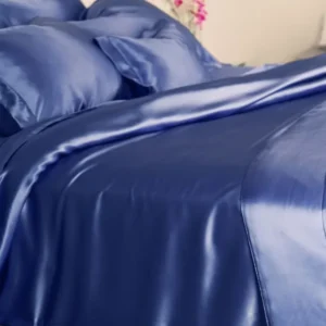 Kumi Kookoon Classic Silk queen duvet cover in sapphire blue satin with pintuck detail.