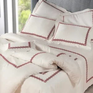 Dea Etruria flat sheet in ivory with red Greek key embroidered border.