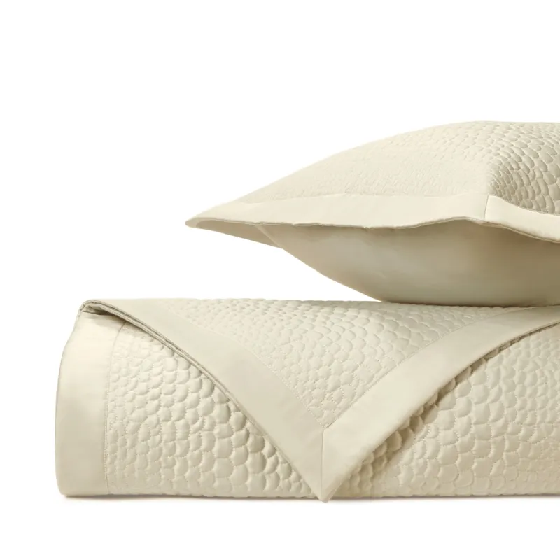 Home Treasures Komodo ivory quilted coverlet and euro sham set, folded stack.