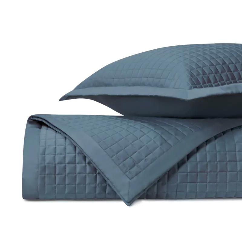 Home Treasures Time Square quilted coverlet set in slate blue with grid stitching.